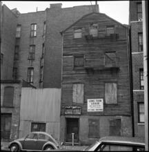 [Old wood framed house, 203 East 29th Street.]