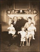 [Al Smith and his wife with their grandchildren.]