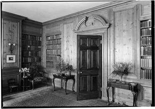 Miss Emily Trevor [residence]. Library door and book shelves.