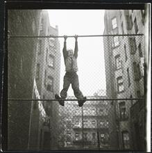 Shoe Shine Boy [Mickey climbing a fence.]