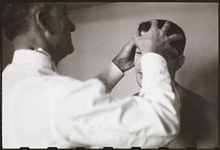 Rocky Graziano, He's a Good Boy Now [Doctor examining Rocky Graziano before a fight.]