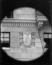 University Club seal on building wall.