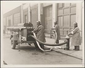 [Fire Auxiliaries testing O. C. D. trailer pump.]