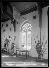 Hall of Armor. Detail of east window, sharp view, vertical.