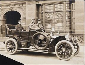 [Firemen in car.]