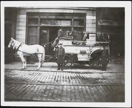 [Firemen with horse-drawn fire engine outside of the station for Engine Company 18.]