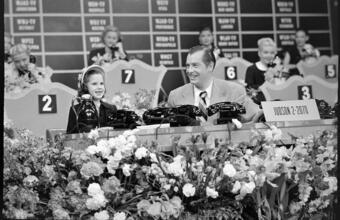 Milton Berle - Damon Runyon Cancer Fund [Milton Berle with a young girl at the telethon.]