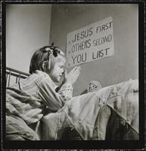 Orphanage [Girl praying.]