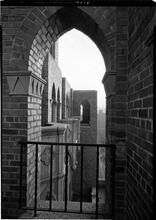 The Barbizon. View of balconies thru arch.