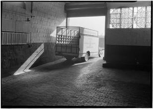 Rex Cole [Warehouse]. Loading platform entrance, truck leaving.