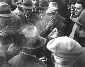 Untitled [Man smoking at left-wing political discussion, Union Square]
