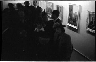 [Social gathering at art gallery.]