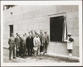 For 34 Years of Loyal Service - Eric S. Barron [Eric Barron and other men, and a woman holding flowers, at the Holland Tunnel plaque.]