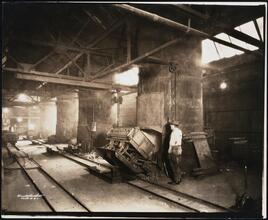 [Interior, manufacturing shop, metal melting furnace oven.]