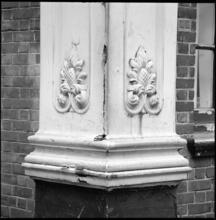 [Ornamentation on the corner of an unidentified building.