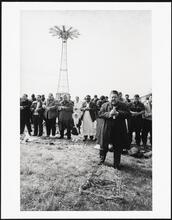 Men observe the call to prayer, Astroland Amusement Park, Coney Island
