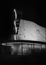 [Night view of the Production and Distribution building, New York World's Fair.]