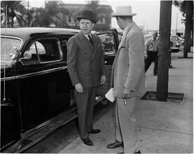 Circus [Two men outside a car.]