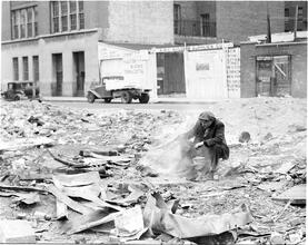 Man Cooking in Junk Lot