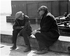 Waterfront. [Two men talking.]
