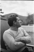 Leonard Bernstein [Leonard Bernstein sitting outside.]