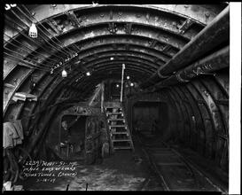 Man inside the southern end of a river tunnel.