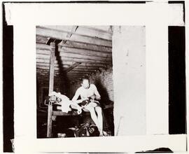 Lodger in Pell Street 7 cents lodging house (Happy Jack's Canvas Palace) going to bed.