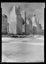 New York City views. 59th Street buidlings over frozen lake, vertical.