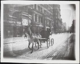 [Firemen in carriage.]