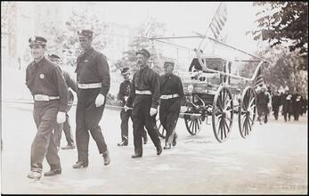 [Firemen pulling carriage.]