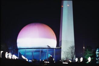 [Trylon and Perisphere at night.]