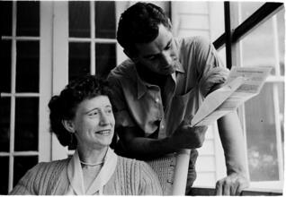 Leonard Bernstein [Leonard Bernstein and a woman reading pages.]