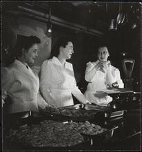Columbia University [Women learning cooking techniques.]