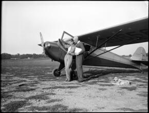 Fashion Models: Lisa Fonssagrives [Lisa and Fernand Fonssagrives in front of an airplane.]