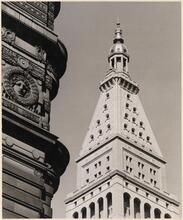 [Ornamented façade of the Flatiron Building, originally the Fuller Building, and the tower of the Metropolitan Life Insurance Company.]