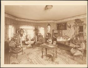 [Residence. Interior, parlor.]