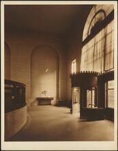 [Bank. Interior, entrance.]