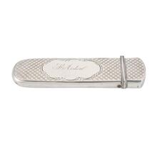 Spectacles case with gold-framed spectacles.