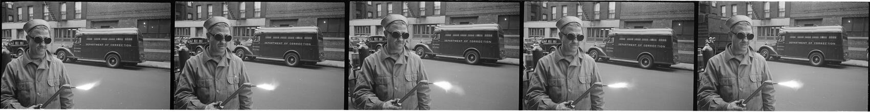 Paddy Wagon [Man with welding equipment used in the making of the television show Paddy Wagon.]