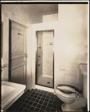 [Interior, bathroom towards toilet and shower.]