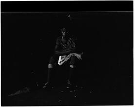 Boy Seated with a Paper.