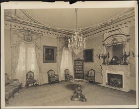 [Residence. Interior, parlor.]