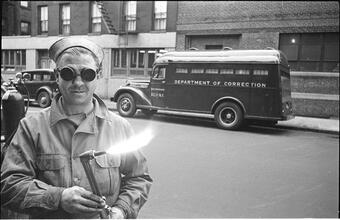 Paddy Wagon [Man with welding equipment used in the making of the television show Paddy Wagon.]