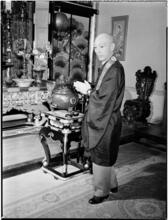[Man praying at an altar.]