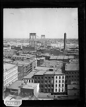 [Brooklyn Bridge under construction.]