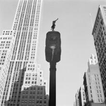 [Street light, 500 Fifth Avenue building in background.]