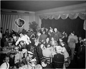 Champagne Cholly Book Party [People eating and socializing at a book party.]