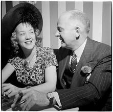 Champagne Cholly Book Party [Woman and man talking.]