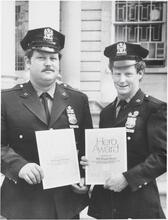 [Two policemen with Hero Awards.]