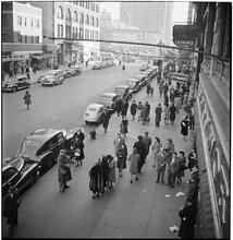 Burl Ives [Burl Ives performing in the street.]